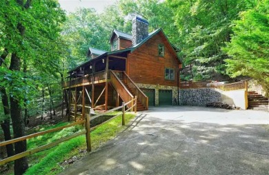 Welcome to this rare 4 bedroom, 3 1/2 bath LOG CABIN find in an on Bent Tree Golf Course in Georgia - for sale on GolfHomes.com, golf home, golf lot