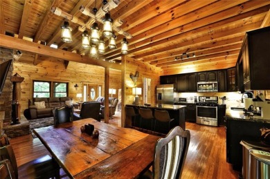 Welcome to this rare 4 bedroom, 3 1/2 bath LOG CABIN find in an on Bent Tree Golf Course in Georgia - for sale on GolfHomes.com, golf home, golf lot