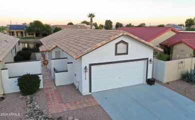 Adorable patio home on Casa Grande Lakes. High ceilings. Bright on Dave White Reg Park and Golf Course in Arizona - for sale on GolfHomes.com, golf home, golf lot