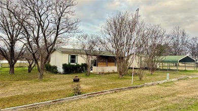 Welcome to Lake Fork Living! This charming 3-bedroom, 2-bathroom on Links At Lands End in Texas - for sale on GolfHomes.com, golf home, golf lot