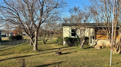 Welcome to Lake Fork Living! This charming 3-bedroom, 2-bathroom on Links At Lands End in Texas - for sale on GolfHomes.com, golf home, golf lot