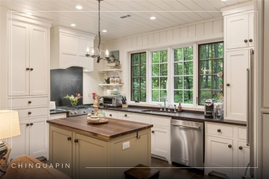 Welcome to this charming custom cottage, nestled among lush on Natures Walk At Chinquapin in North Carolina - for sale on GolfHomes.com, golf home, golf lot