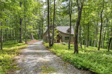 Welcome to this charming custom cottage, nestled among lush on Natures Walk At Chinquapin in North Carolina - for sale on GolfHomes.com, golf home, golf lot