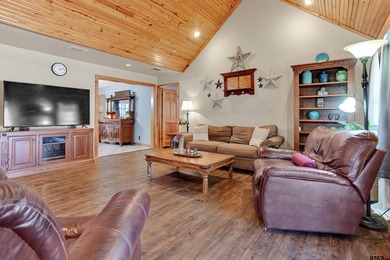 This stunning Satterwhite log home offers 2,550 square feet of on Hide-A-Way Lake Golf Course in Texas - for sale on GolfHomes.com, golf home, golf lot