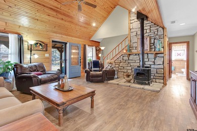 This stunning Satterwhite log home offers 2,550 square feet of on Hide-A-Way Lake Golf Course in Texas - for sale on GolfHomes.com, golf home, golf lot