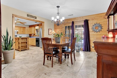 This stunning Satterwhite log home offers 2,550 square feet of on Hide-A-Way Lake Golf Course in Texas - for sale on GolfHomes.com, golf home, golf lot