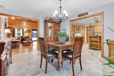 This stunning Satterwhite log home offers 2,550 square feet of on Hide-A-Way Lake Golf Course in Texas - for sale on GolfHomes.com, golf home, golf lot