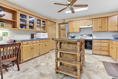 This stunning Satterwhite log home offers 2,550 square feet of on Hide-A-Way Lake Golf Course in Texas - for sale on GolfHomes.com, golf home, golf lot