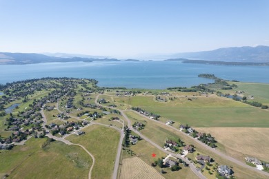 Discover your dream home site on .72 acres with breathtaking on Polson Bay Golf Course - Championship Course in Montana - for sale on GolfHomes.com, golf home, golf lot