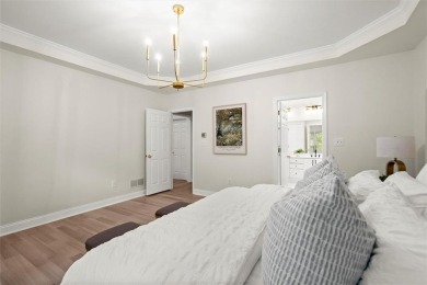 Experience refined living at 1010 Graystone Crossing, nestled in on The Golf Club of Georgia in Georgia - for sale on GolfHomes.com, golf home, golf lot
