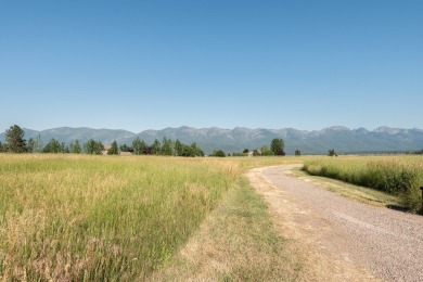 Discover your dream home site on .72 acres with breathtaking on Polson Bay Golf Course - Championship Course in Montana - for sale on GolfHomes.com, golf home, golf lot