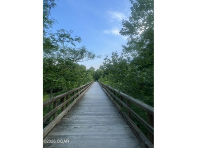 Just in time for golf and pool season, this beautifully on Briarbrook Golf Course in Missouri - for sale on GolfHomes.com, golf home, golf lot