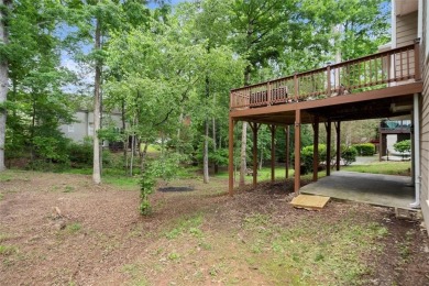 Experience refined living at 1010 Graystone Crossing, nestled in on The Golf Club of Georgia in Georgia - for sale on GolfHomes.com, golf home, golf lot