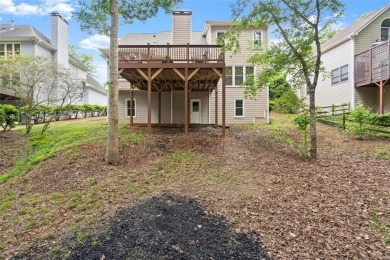 Experience refined living at 1010 Graystone Crossing, nestled in on The Golf Club of Georgia in Georgia - for sale on GolfHomes.com, golf home, golf lot