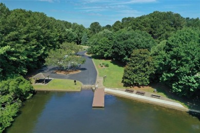 Experience refined living at 1010 Graystone Crossing, nestled in on The Golf Club of Georgia in Georgia - for sale on GolfHomes.com, golf home, golf lot
