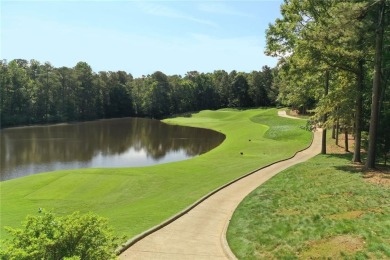 Experience refined living at 1010 Graystone Crossing, nestled in on The Golf Club of Georgia in Georgia - for sale on GolfHomes.com, golf home, golf lot