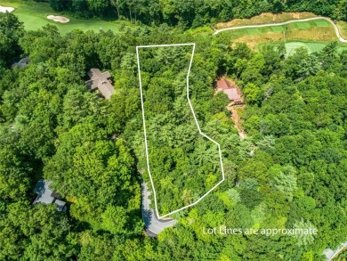 Nestled between holes 11 and 12 of Lake Toxaway Country Club's on Lake Toxaway Country Club in North Carolina - for sale on GolfHomes.com, golf home, golf lot