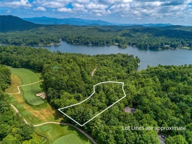Nestled between holes 11 and 12 of Lake Toxaway Country Club's on Lake Toxaway Country Club in North Carolina - for sale on GolfHomes.com, golf home, golf lot