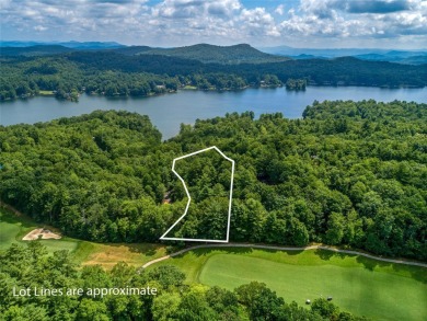 Nestled between holes 11 and 12 of Lake Toxaway Country Club's on Lake Toxaway Country Club in North Carolina - for sale on GolfHomes.com, golf home, golf lot