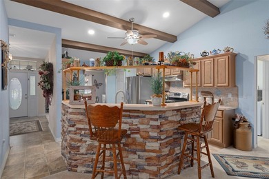 Exquisite 3 Bedroom, 3 Bathroom Pool Home Overlooking The Golf on Sherman Hills Golf Club in Florida - for sale on GolfHomes.com, golf home, golf lot