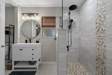 Exquisite 3 Bedroom, 3 Bathroom Pool Home Overlooking The Golf on Sherman Hills Golf Club in Florida - for sale on GolfHomes.com, golf home, golf lot