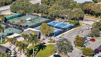 ELEVATE YOURSELF into this lovely second-floor coach home in on Pelican Marsh Golf Club in Florida - for sale on GolfHomes.com, golf home, golf lot