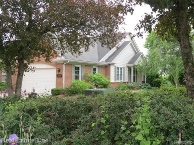 Welcome to this beautiful end unit condo in Country Club Village on Bushwood Golf Club in Michigan - for sale on GolfHomes.com, golf home, golf lot