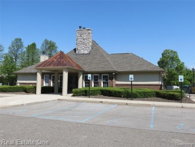 Welcome to this beautiful end unit condo in Country Club Village on Bushwood Golf Club in Michigan - for sale on GolfHomes.com, golf home, golf lot