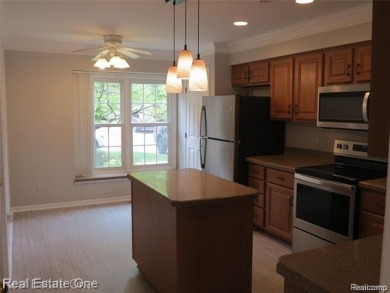 Welcome to this beautiful end unit condo in Country Club Village on Bushwood Golf Club in Michigan - for sale on GolfHomes.com, golf home, golf lot
