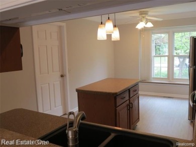 Welcome to this beautiful end unit condo in Country Club Village on Bushwood Golf Club in Michigan - for sale on GolfHomes.com, golf home, golf lot
