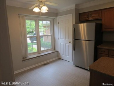 Welcome to this beautiful end unit condo in Country Club Village on Bushwood Golf Club in Michigan - for sale on GolfHomes.com, golf home, golf lot