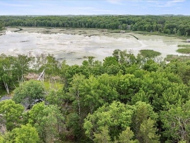 Discover your lakeside paradise with this 100-foot level lot on on Deacons Lodge Golf Course in Minnesota - for sale on GolfHomes.com, golf home, golf lot