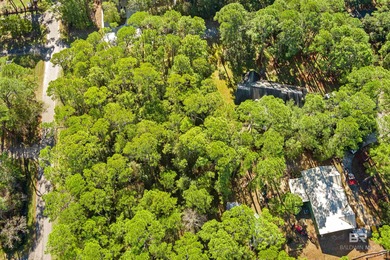Beautiful wooded residential lot on Dauphin Island, measuring on Isle Dauphine Club Golf Course in Alabama - for sale on GolfHomes.com, golf home, golf lot