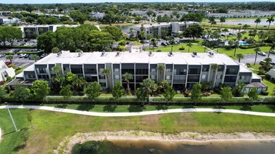 Beautifully renovated and FULLY FURNISHED offered turn-key, this on Fountains Golf and Country Club in Florida - for sale on GolfHomes.com, golf home, golf lot