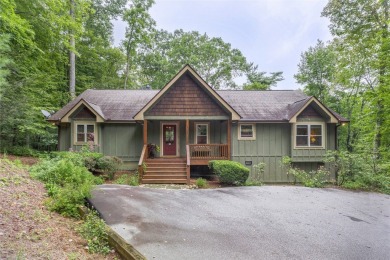 Enjoy an inviting three-bedroom, two-bathroom Arts and Crafts on Sapphire National Golf Club in North Carolina - for sale on GolfHomes.com, golf home, golf lot