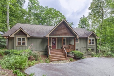 Enjoy an inviting three-bedroom, two-bathroom Arts and Crafts on Sapphire National Golf Club in North Carolina - for sale on GolfHomes.com, golf home, golf lot