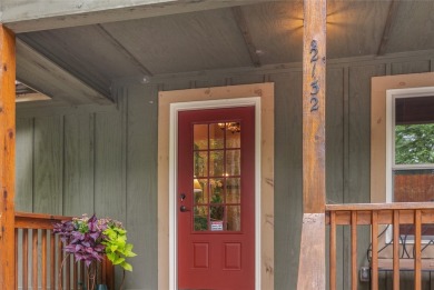 Enjoy an inviting three-bedroom, two-bathroom Arts and Crafts on Sapphire National Golf Club in North Carolina - for sale on GolfHomes.com, golf home, golf lot