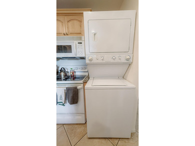 Beautifully renovated and FULLY FURNISHED offered turn-key, this on Fountains Golf and Country Club in Florida - for sale on GolfHomes.com, golf home, golf lot