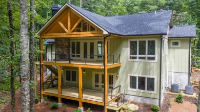 Discover the epitome of modern mountain living with this brand on Sapphire National Golf Club in North Carolina - for sale on GolfHomes.com, golf home, golf lot