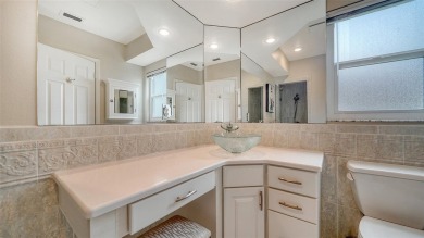 Gorgeously updated and hurricane-ready, this lakefront pool home on The Meadows Golf and Country Club in Florida - for sale on GolfHomes.com, golf home, golf lot