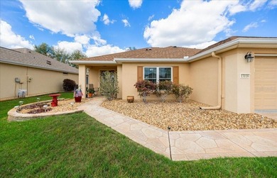 Located in Spruce Creek Golf & Country Club, this beautifully on Eagle Ridge At Spruce Creek Country Club in Florida - for sale on GolfHomes.com, golf home, golf lot