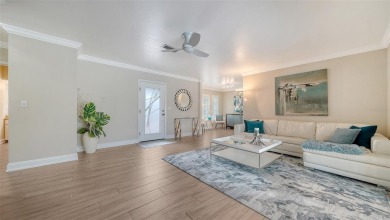 Gorgeously updated and hurricane-ready, this lakefront pool home on The Meadows Golf and Country Club in Florida - for sale on GolfHomes.com, golf home, golf lot