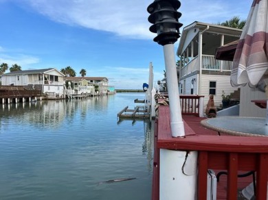 Experience coastal living at its finest with this charming on Long Island Golf Course in Texas - for sale on GolfHomes.com, golf home, golf lot