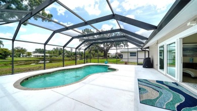 Gorgeously updated and hurricane-ready, this lakefront pool home on The Meadows Golf and Country Club in Florida - for sale on GolfHomes.com, golf home, golf lot