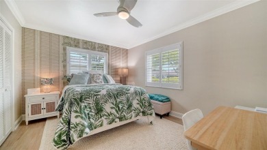 Gorgeously updated and hurricane-ready, this lakefront pool home on The Meadows Golf and Country Club in Florida - for sale on GolfHomes.com, golf home, golf lot