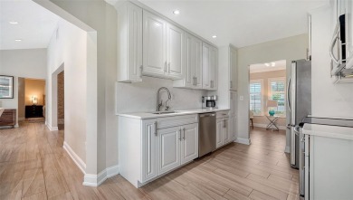 Gorgeously updated and hurricane-ready, this lakefront pool home on The Meadows Golf and Country Club in Florida - for sale on GolfHomes.com, golf home, golf lot