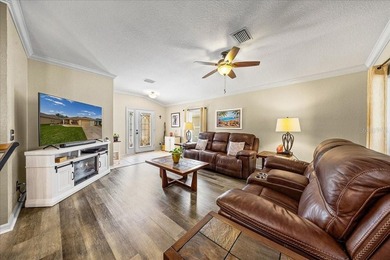 Located in Spruce Creek Golf & Country Club, this beautifully on Eagle Ridge At Spruce Creek Country Club in Florida - for sale on GolfHomes.com, golf home, golf lot