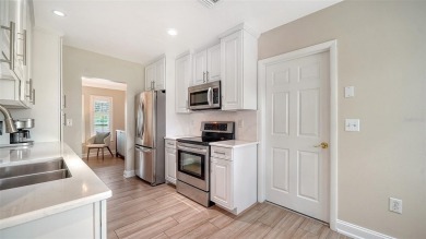 Gorgeously updated and hurricane-ready, this lakefront pool home on The Meadows Golf and Country Club in Florida - for sale on GolfHomes.com, golf home, golf lot