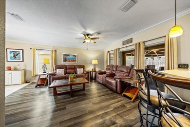 Located in Spruce Creek Golf & Country Club, this beautifully on Eagle Ridge At Spruce Creek Country Club in Florida - for sale on GolfHomes.com, golf home, golf lot