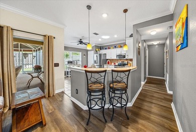 Located in Spruce Creek Golf & Country Club, this beautifully on Eagle Ridge At Spruce Creek Country Club in Florida - for sale on GolfHomes.com, golf home, golf lot